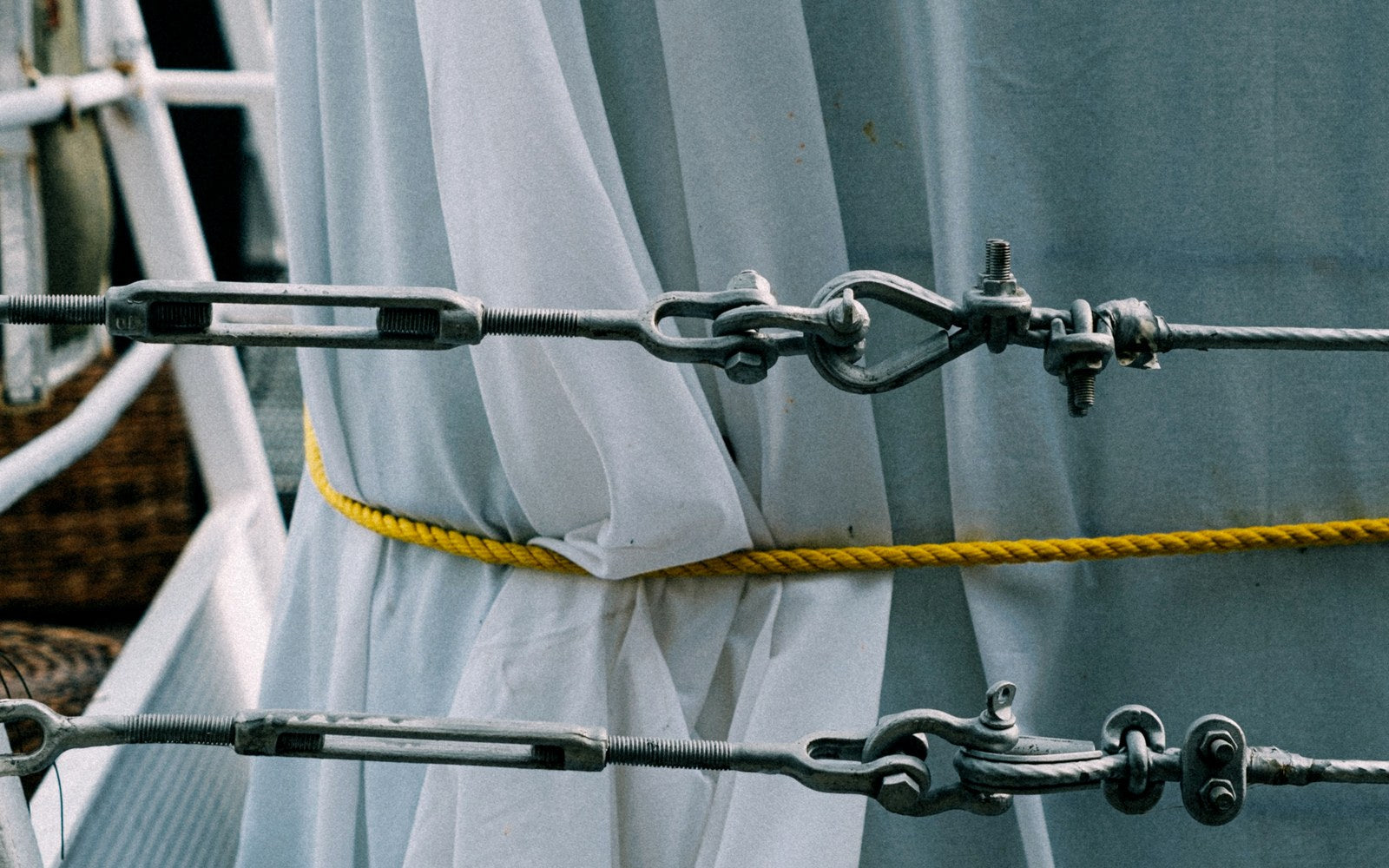Close-up of stainless marine turnbuckles and rigging hardware