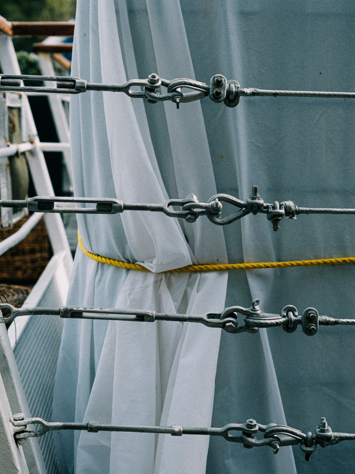 Marine turnbuckles and rigging hardware on a sailing vessel